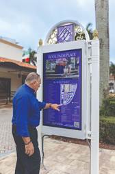 a man pointing to a map sign